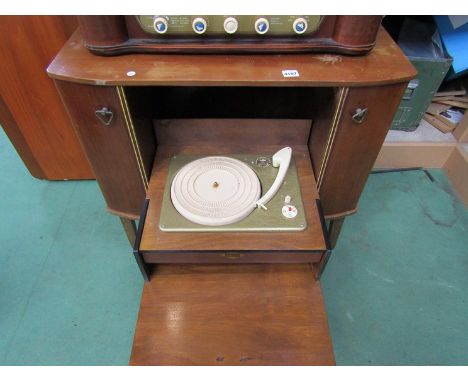 A vintage record player in wooden cabinet 