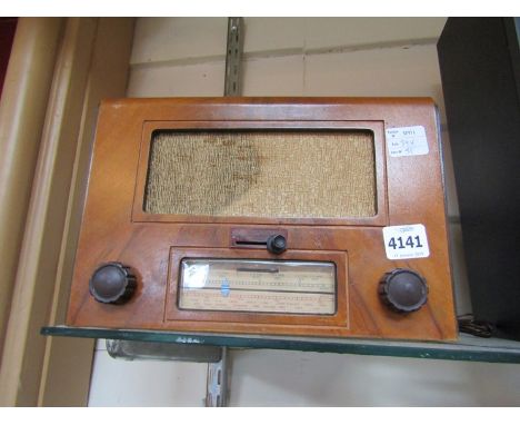 A vintage McCarthy walnut cased radio