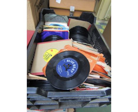 A box of 7" singles including The Rolling Stones and Prince Buster