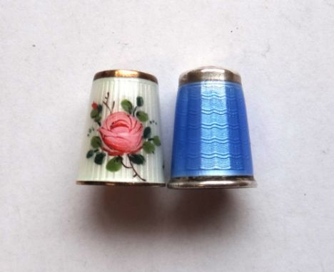 A Norwegian silver guilloche enamelled thimble by David Andersen, with a pink rose design on a white ground and gold wash int