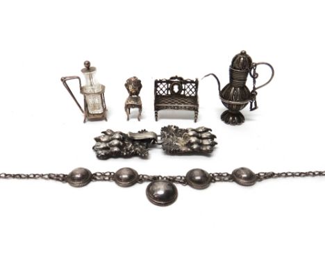 A silver miniature twin seat interior bench, of Continental classical style, import mark London 1902, a silver miniature chai