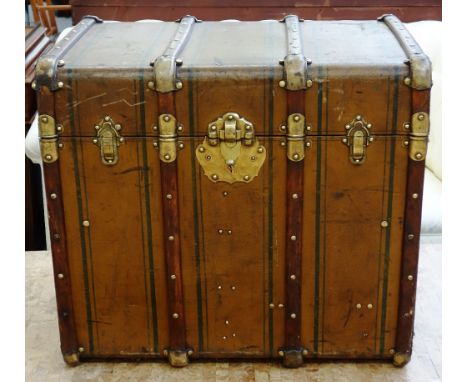 A French wood and canvas bound steamer trunk, early 20th century, the brass hardware stamped 'Brevette', with a lion symbol, 