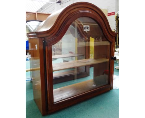 A pair of walnut framed glazed hanging display cabinets, each with serpentine arched top above two shelf interior, 42cm (2).
