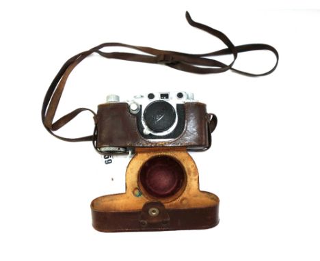 A Leica DRP camera with Lietz Elmar lens and leather case, serial number 513479, with an 'Ikophot' lightmeter and lens adapto