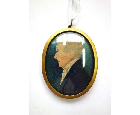 English School, early 19th century, portrait miniature profile of a gentleman facing the left, wearing a blue coat and a whit