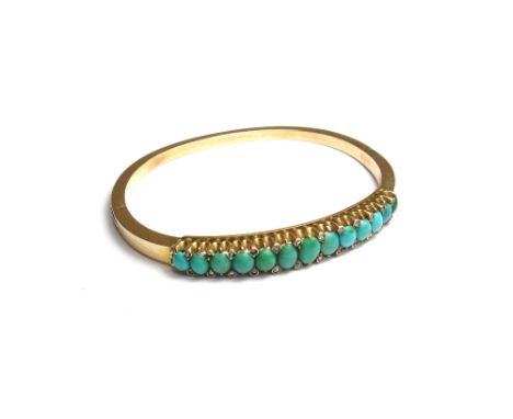 A turquoise set oval hinged bangle, the front mounted with a row of graduated oval turquoise and with pairs of rose diamond p