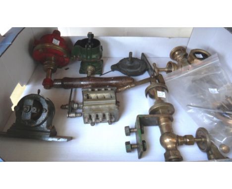 A 'Stuart' electric fly wheel, 9cm high, an Empire engineering small steam engine, a painted brass valve head, a French brass