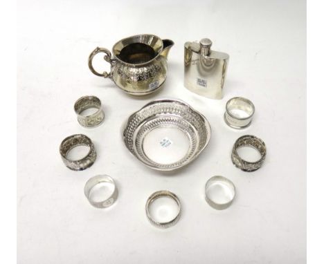 A pair of silver napkin rings with engine turned decoration, Sheffield 1897, two further silver napkin rings and plated wares