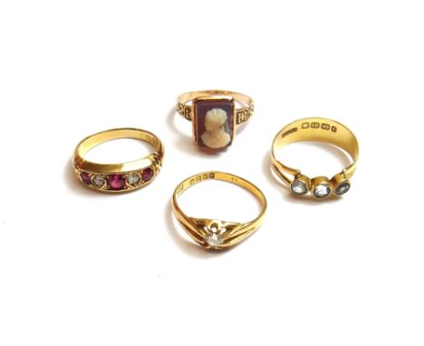 A gold and sardonyx cameo ring, carved as the portrait of a lady, an 18ct gold and diamond set single stone ring, claw set wi
