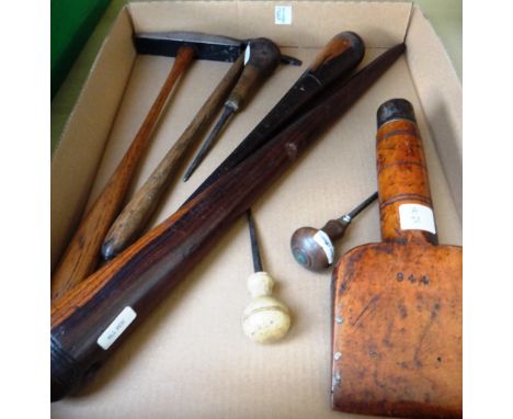 A collection of vintage tools, including; two hardwood sailors rope making fids, 46cm, a fruitwood wedge, two hammers with ta