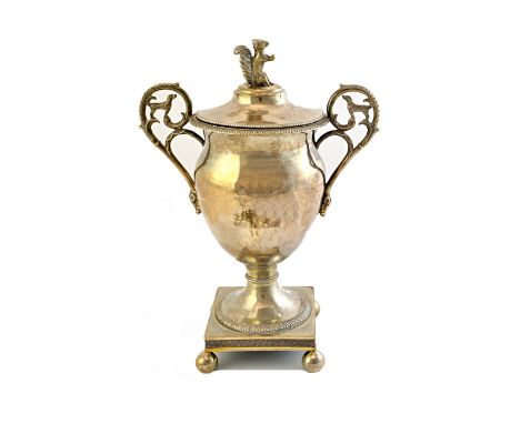 A French twin handled cup and cover, pierced with rustic handles, having dog motifs, raised on a square base, with spherical 