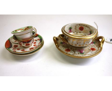 A small Derby two-handled bowl and two-handled stand, circa 1820, painted with flowers with gilt leaves, red painted mark, st