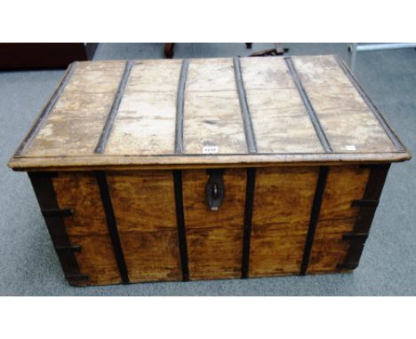 An iron bound teak trunk with side carry handles, 83cm wide. 87