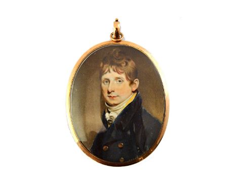 An early 19th century English School portrait miniature on ivory of a young man wearing a dark blue coat and white stock, set