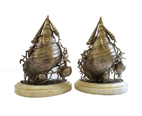 A pair of silvered bronze and marble mounted wall brackets, late 20th century, the body formed as a large conch shell within 