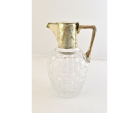 A Victorian silver mounted faceted glass claret jug, having an angular handle and with a flat hinged lid, by William Hutton a
