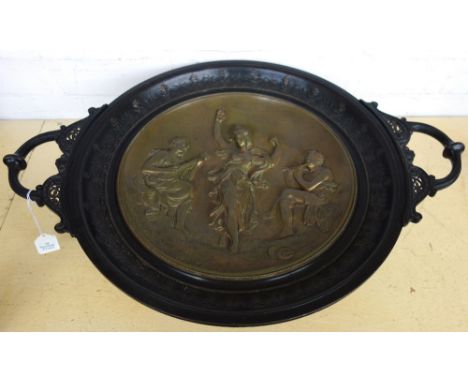Marcel Debut (1865-1933), a bronze tazza dish relief cast with Terpsichore and her musicians, within a beaded and foliate cas