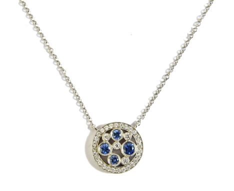 A Tiffany & Co Cobblestone, platinum, Montana sapphire and diamond set pendant necklace, the cluster of circular form, mounte