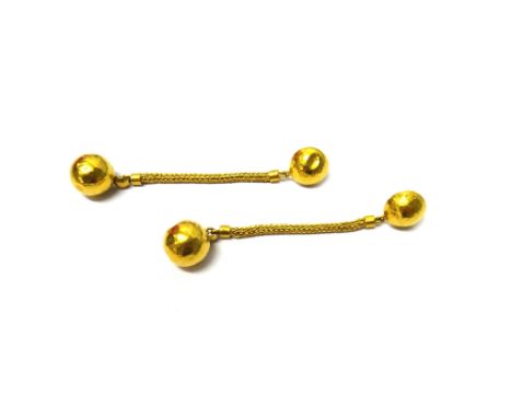 A pair of gold pendant earrings, each with a hemispherical top connected to a spherical drop by a length of Brazil link chain