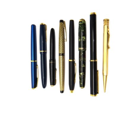 A black and gilt decorated plastic Shaeffer fountain pen, with the original instructions, case and box, a marbled green plast