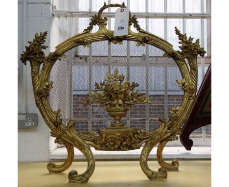 A French gilt bronze fire screen of Louis XV style, late 19th century, with cast numbers to the reverse, 71cm high. 
