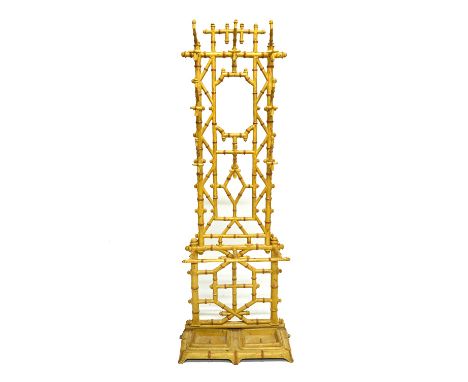 A Coalbrookdale style painted faux bamboo cast iron hall stand, with eight coat hooks and twin umbrella stand, 58cm wide x 18