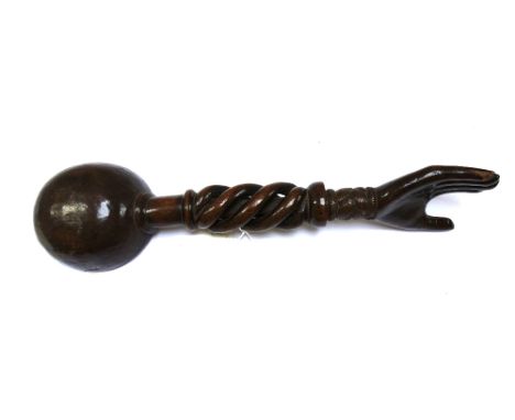 Treen; a Victorian soft wood ladle, the terminal carved with an outstretched hand, with barley-twist shaft and crude shallow 