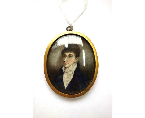 Early 19th century, English School, portrait miniature on ivory of a young gentleman wearing a dark blue coat a white shirt a