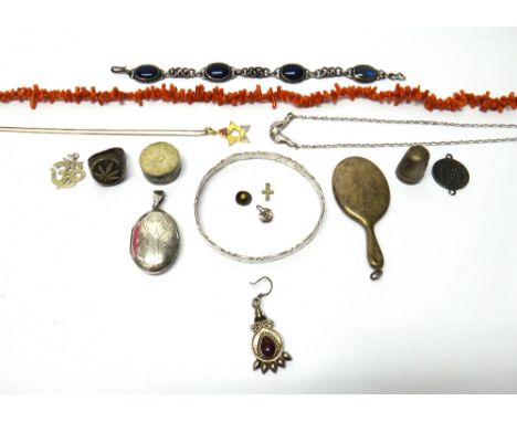 A single row necklace of branch coral, a gold back and front heart shaped pendant locket, a gold back and front oval pendant 