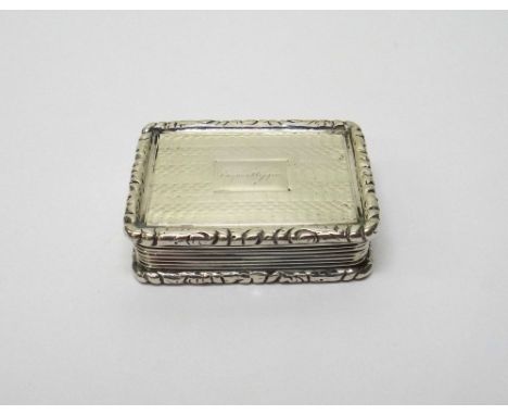 A William IV silver rectangular vinaigrette, with a scroll engraved and pierced gilt grill, the exterior engine turned within