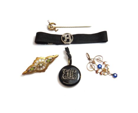 A rose diamond set and black enamelled circular pendant mourning locket, one side with a rose diamond set cross, the other si