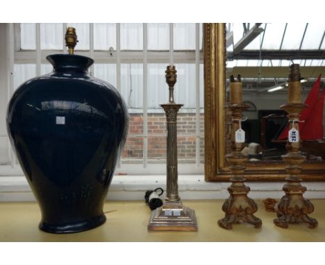 A pair of painted pine altar stick table lamps of 17th century style, 32.5cm high, together with a silver plated table lamp o