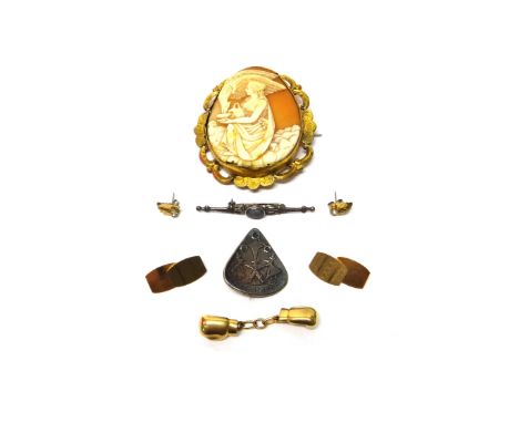 A Victorian oval shell cameo brooch, carved as Ganymede feeding the eagle, within a scroll pierced surround, a pair of 9ct go