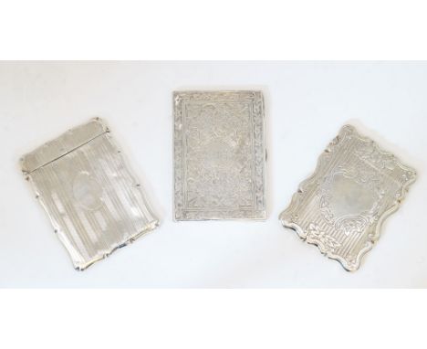 A group of three silver card cases, comprising: a Victorian example, Birmingham, 1876, probably Hilliard & Thomason, marks ru
