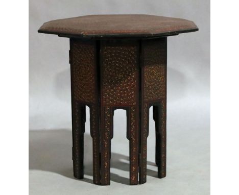 A middle eastern lacquered octagonal lamp table, late 20th century, painted with red, green and yellow peacock design, 44cm h