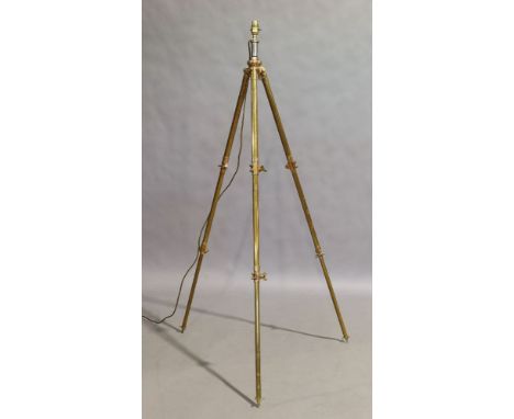 A brass and copper adjustable tripod standard lamp, 20th century, etched and stamped with makers name and mark, 140cm highIt 