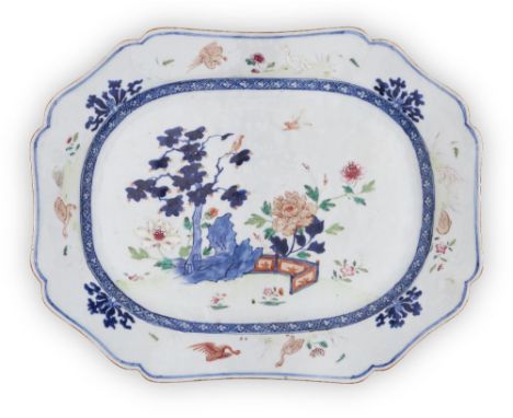 A large Chinese blue and white and famille rose meat platter, 18th century, painted with tree, rock, birds and flowers to the