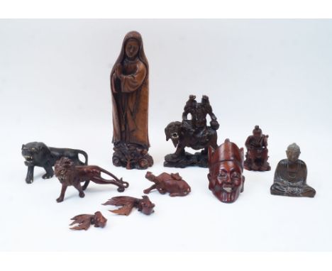A group of ten Chinese wood carvings, early 20th century, comprising a figure of standing Madonna for the export market, 29.5