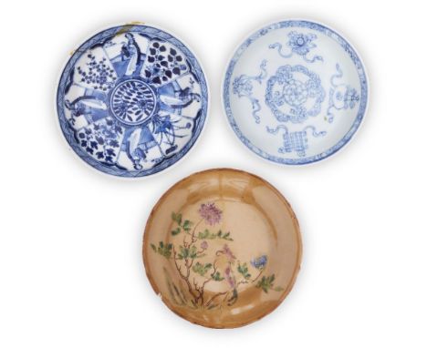 Three Chinese saucers, 18th-19th century, comprising a blue and white Kangxi 'ladies' saucer, with four-character Kangxi mark