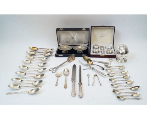 A collection of silver plate, to include: silver sugar tongs, decorated with apostles, London, 1906, William Hutton & Sons Lt