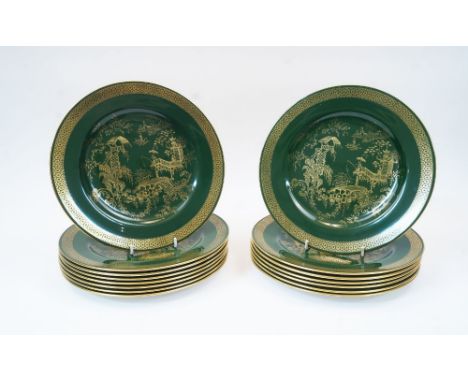 A group of fifteen Spode dinner plates, 20th century, of green ground with gilded Chinoiserie landscape to the well and gilde