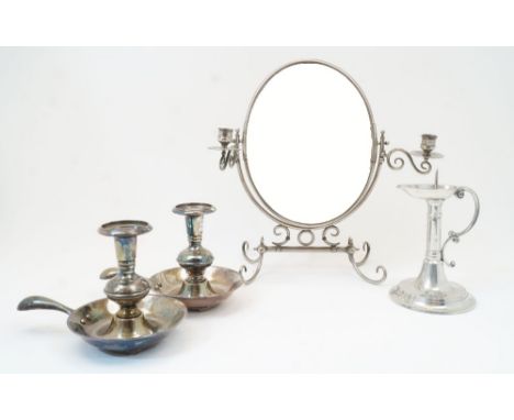 A group of candlesticks, to include a pair of silvered copper chambersticks with knopped and reeded stems, handles and drip p
