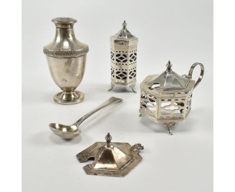 A collection of hallmarked silver condiments. To include a hallmarked silver salt or pepper shaker, condiment pot, cruet, lid