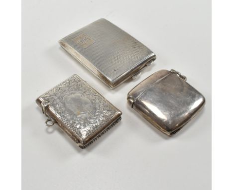 A collection of hallmarked silver vestas and match book case. The match book&nbsp; case with engine turned repeated pattern, 