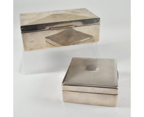 Two hallmarked silver Art Deco cigarette boxes. The boxes both having engine turned decoration to the lids and wooden lining.