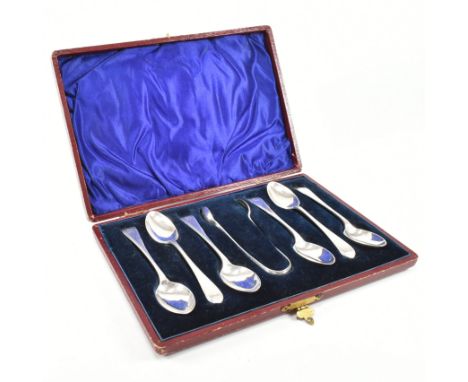 A hallmarked silver cased spoon and sugar tong set. The hallmarked silver set being cased in original, hinged, red leather, v