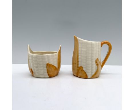 A charming pair designed in the likeness of corn cobs, complete with orange leaves for a delightful touch. Clinchfield backst