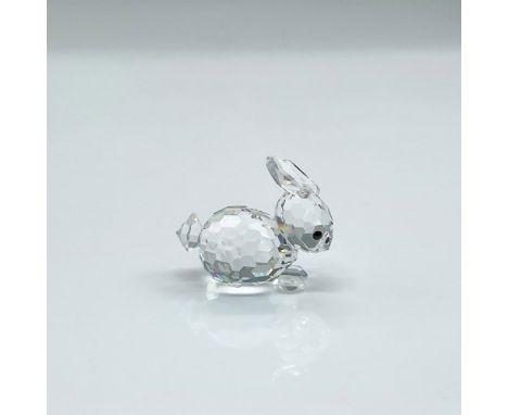 Clear faceted crystal figure of a little rabbit with black eyes lying down resting. Swarovski mark. Part of the In A Summer M