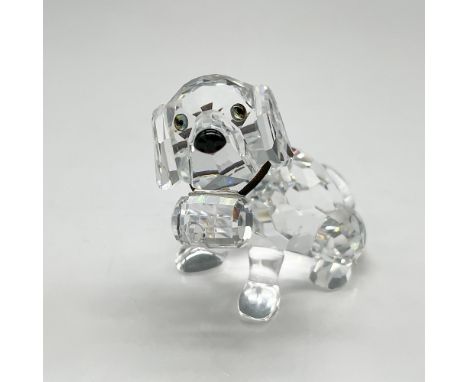 Clear faceted figural with tawny eyes, black nose, and elastic collar holding the cask. Swarovski backstamp. 7619 000 006. Th