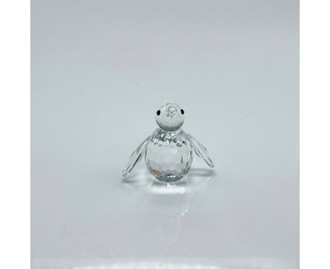 Clear faceted crystal figure of mini penguin with black eyes. Swarovski mark. This item has its original box: 2.5"H x 3.25" d